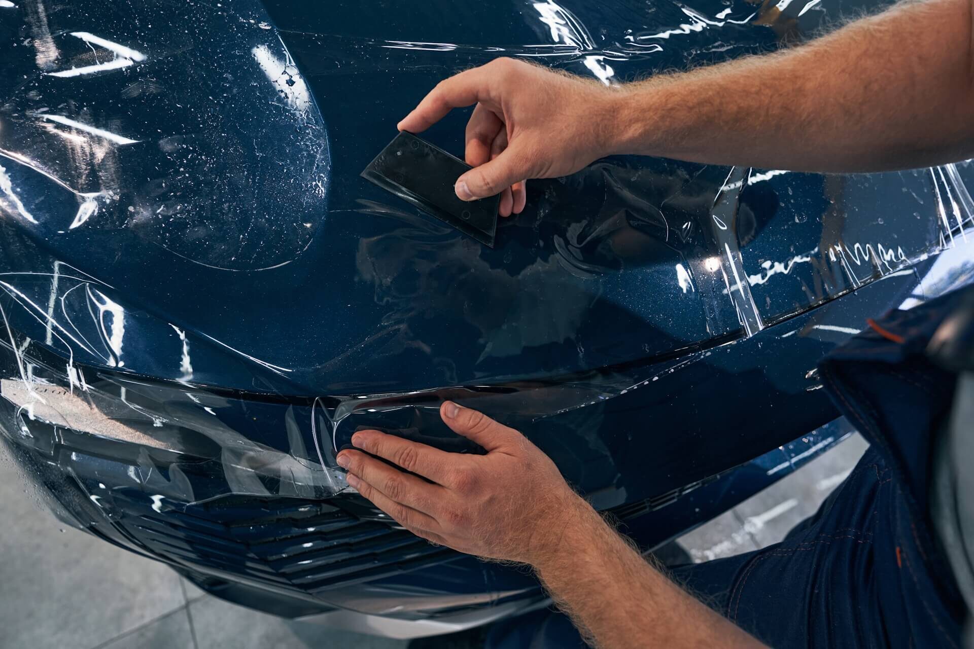 Automotice design and protection specialist applying PPF to Vehicle in Baltimore, MD