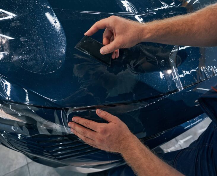 Automotice design and protection specialist applying PPF to Vehicle in Baltimore, MD